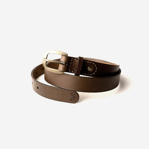 a rich brown leather belt with an aged brass buckle, etched logo and hand stitched detailing.
